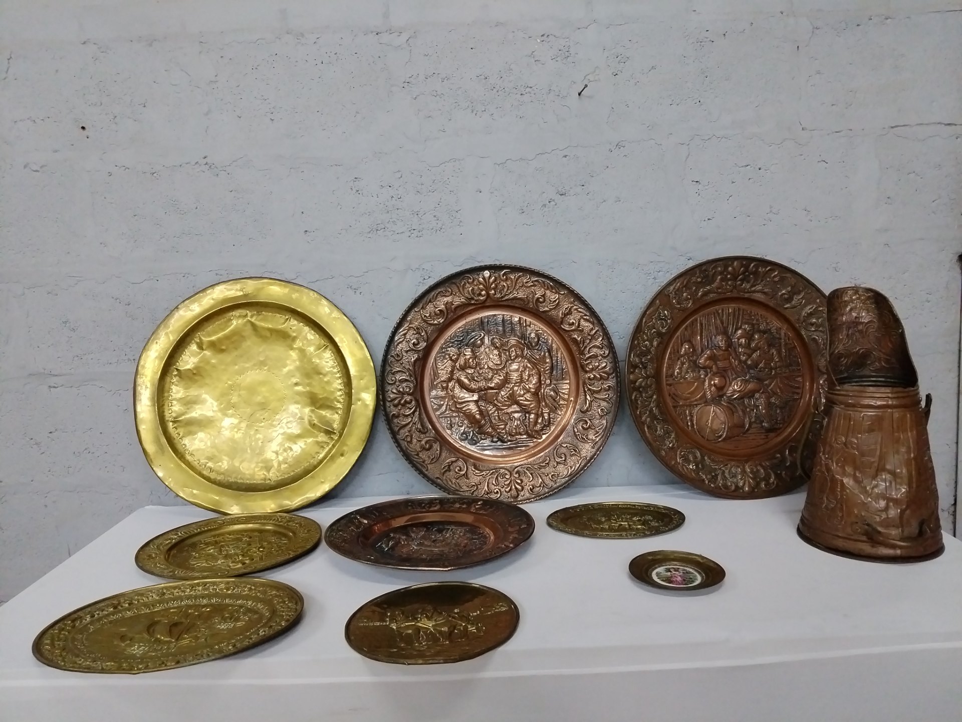 Lot of 10 Embossed Decorative Brass/Copper Wall Plates & Large Handled Vessel — Repoussé Scenes, Patina & Wear