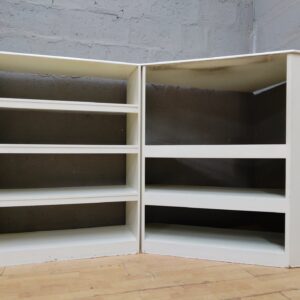 Corner display shelving unit — joined two-section white MDF/particleboard, multiple open shelves