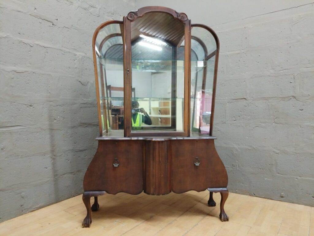 Bombe‑base Glass Vitrine / Display Cabinet with Curved Glass & Two Shelves — Broken Top Moulding