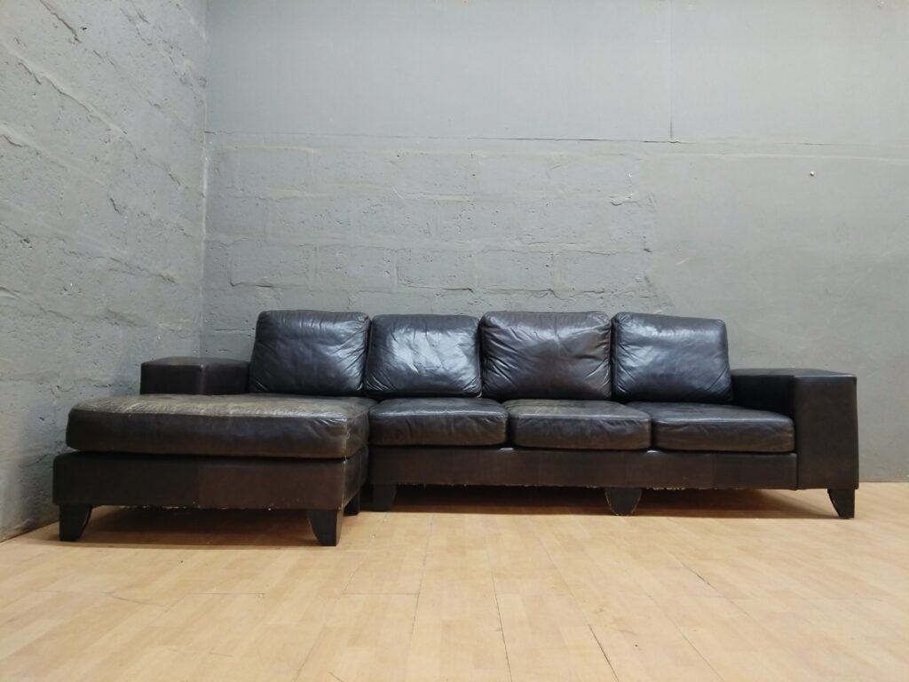 Left‑facing 3‑seat leather corner sofa with chaise — heavy patina, restoration project