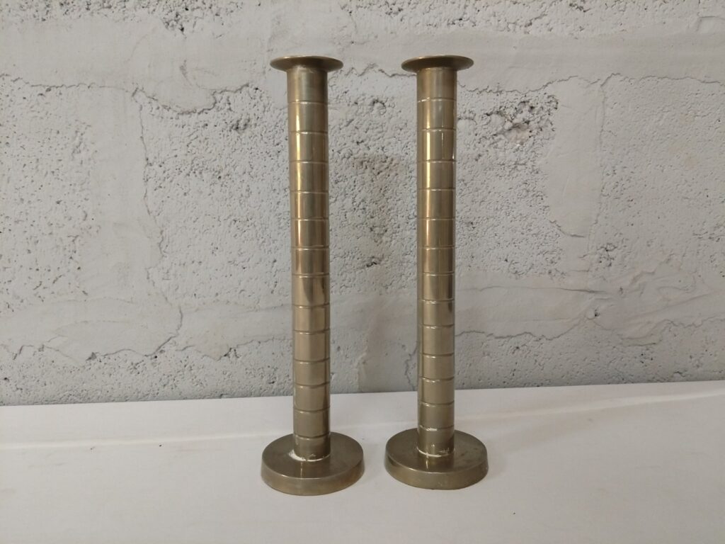 Pair of brass‑coloured candlesticks, stepped column detail — 30 cm tall (used, visible repairs & wear)