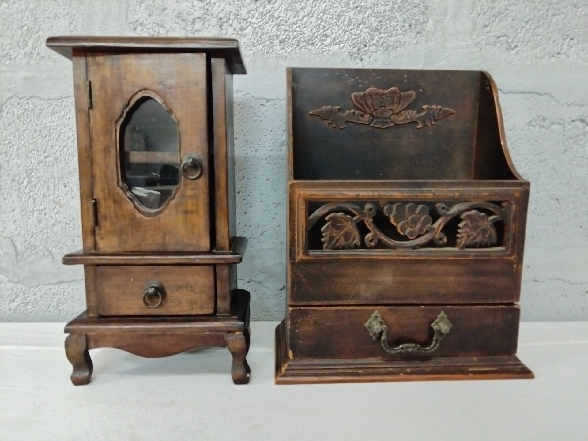Pair of small carved wooden organisers — glass-front cabinet + open floral organiser, drawers