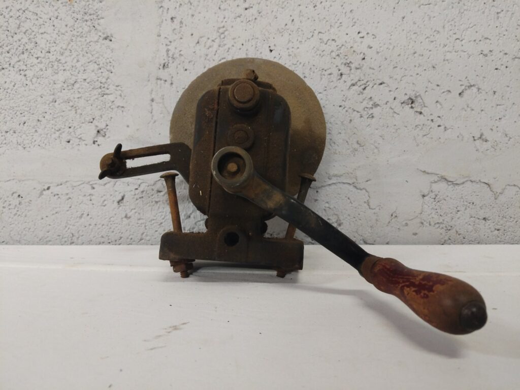 Vintage Henry Baker hand-crank bench grinder / wheel sharpener – cast-iron clamp mount