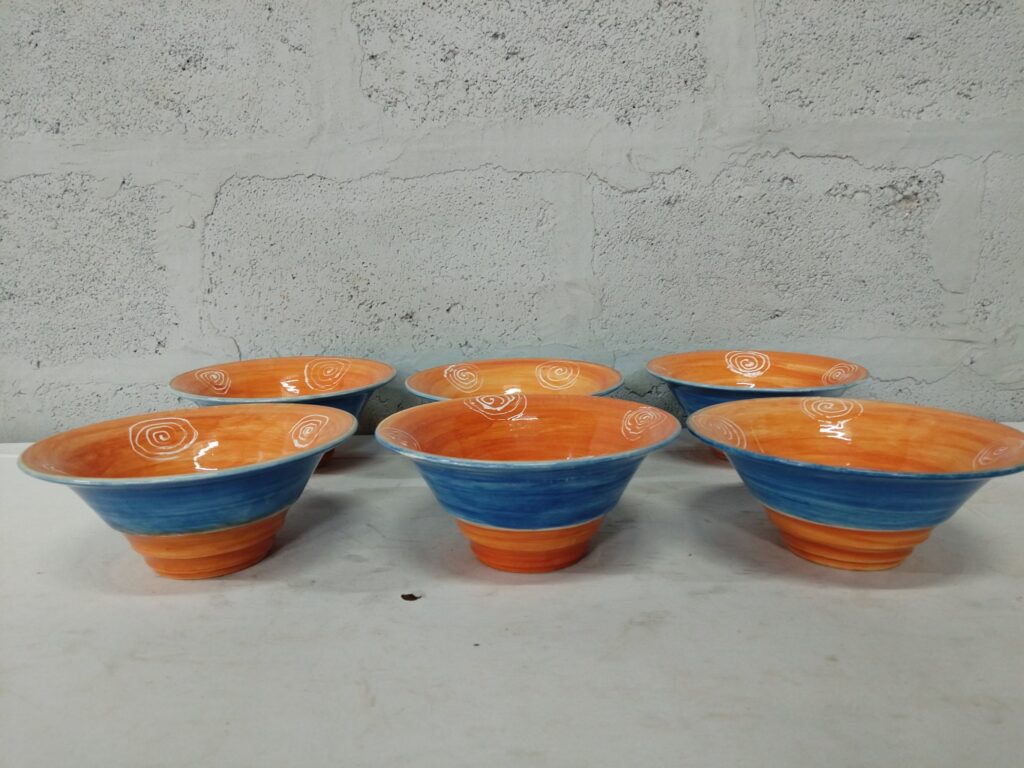 Set of 6 hand‑decorated glazed ceramic bowls — orange interior / blue exterior, base marked HCB, approx 16cm