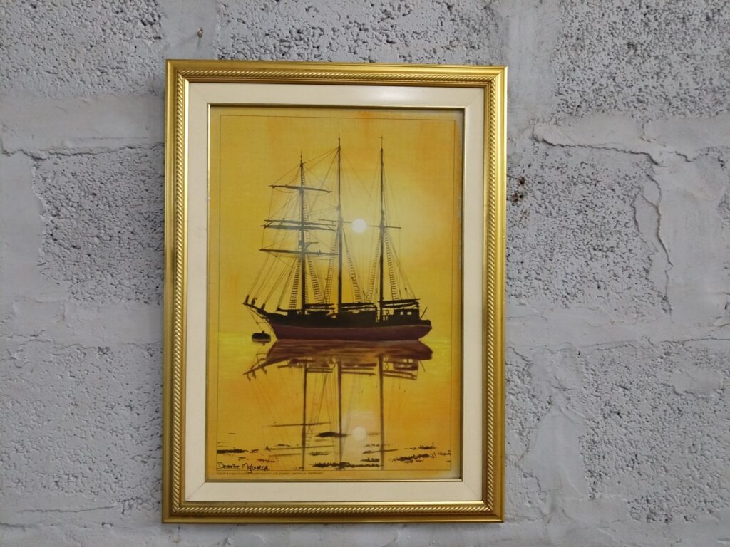 Signed framed ship print (warm yellow sunset) — gold decorative frame, 44 x 50 cm