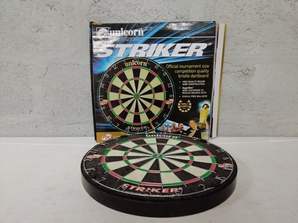 Unicorn Striker bristle dartboard with original box and mounting brackets