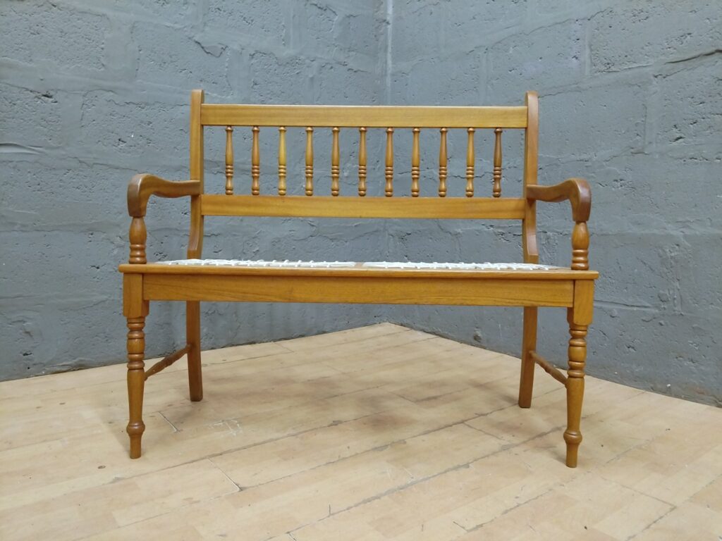 Wooden two-seater bench / settle with spindle back & woven strap seat