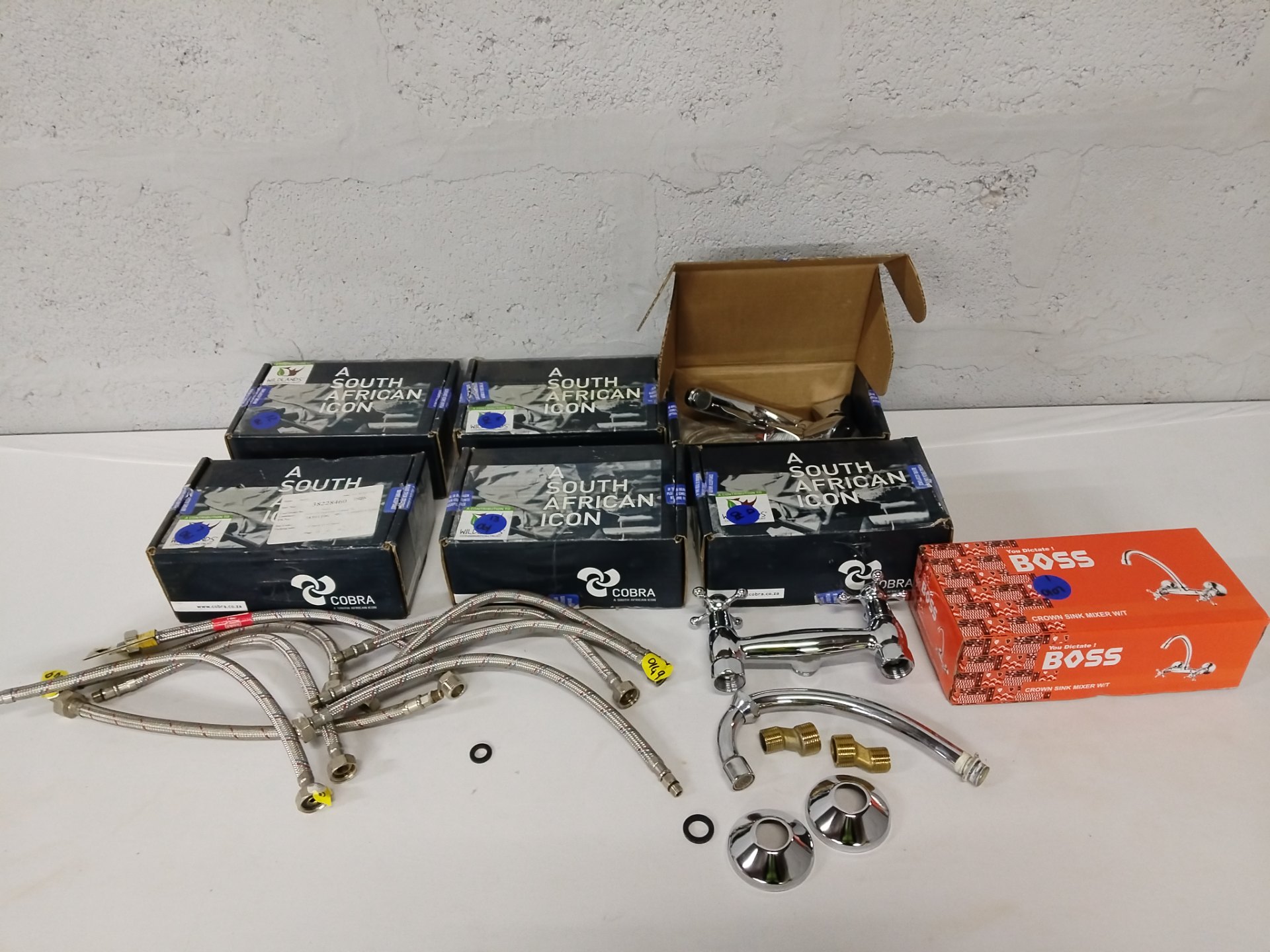 Mixed lot: basin/sink mixers, braided supply hoses & fittings — Cobra Protea PA‑851 boxes + Boss Crown box (some opened)