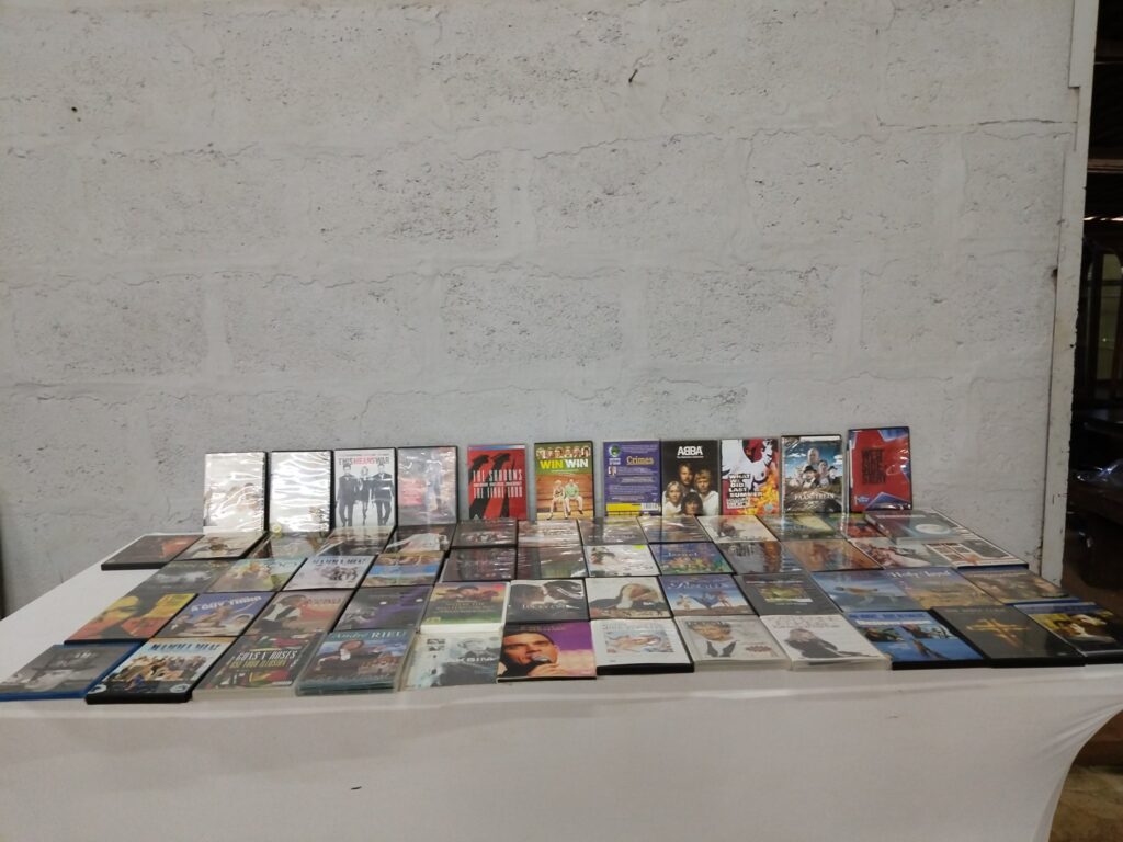 Mixed bulk lot — 49 DVD & VHS titles (music, films, concerts) — many shrink-wrapped; some tested