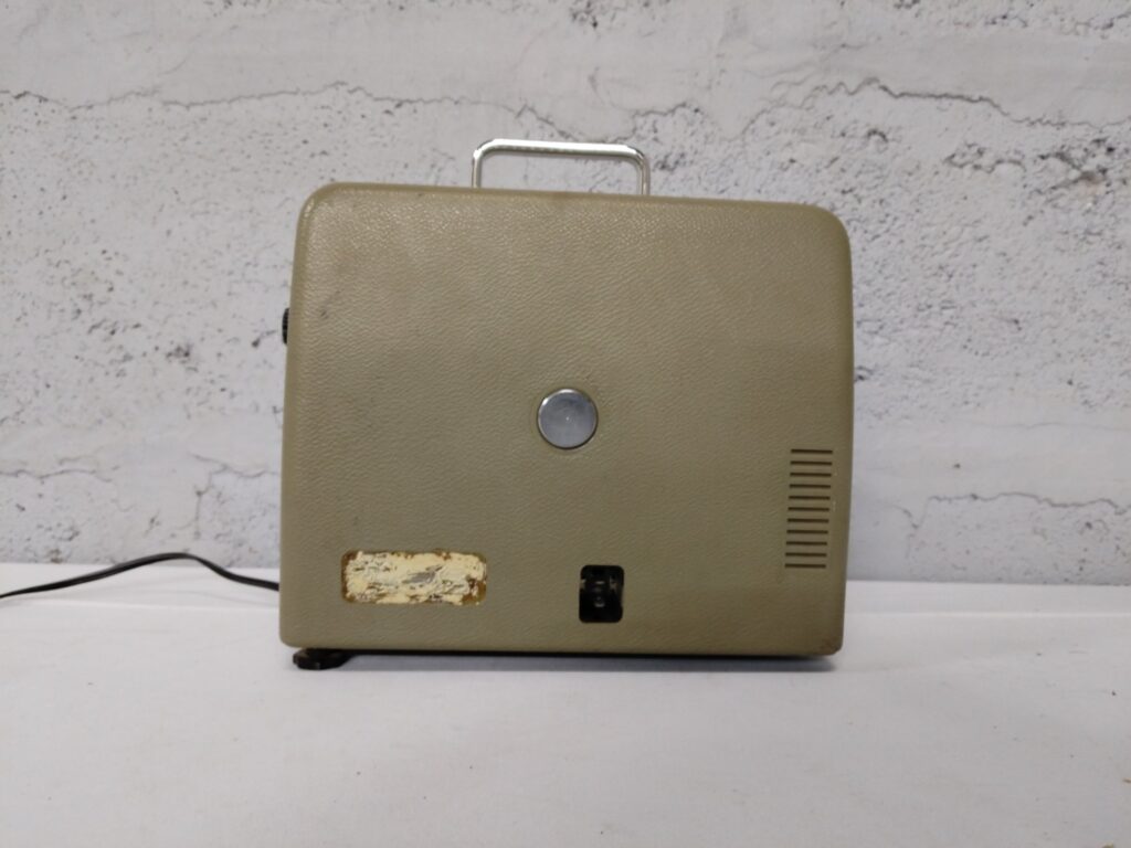 Vintage portable powered unit (likely projector) — chrome carry handle, power cord included — NOT WORKING