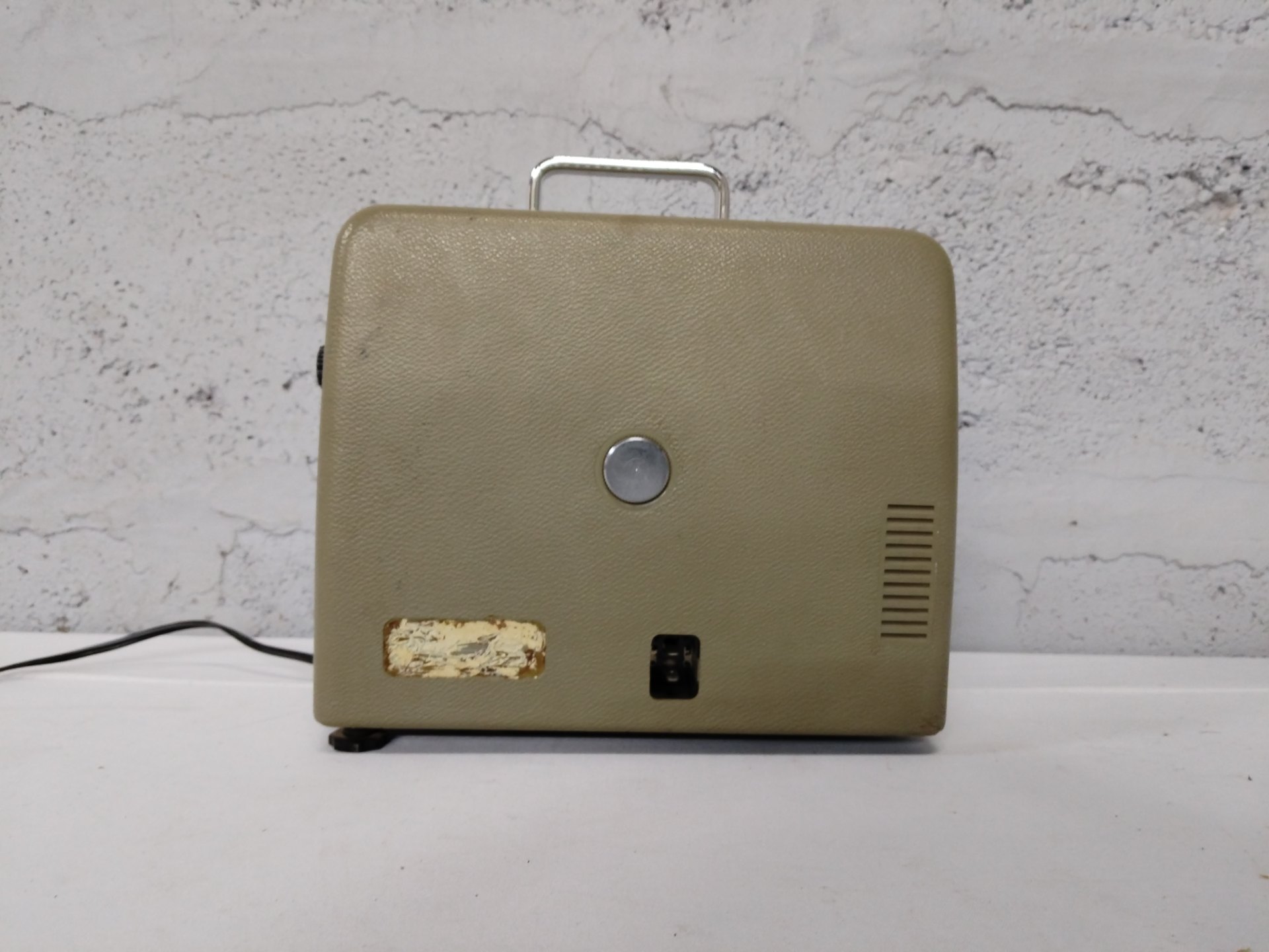 Vintage portable powered unit (likely projector) — chrome carry handle, power cord included — NOT WORKING