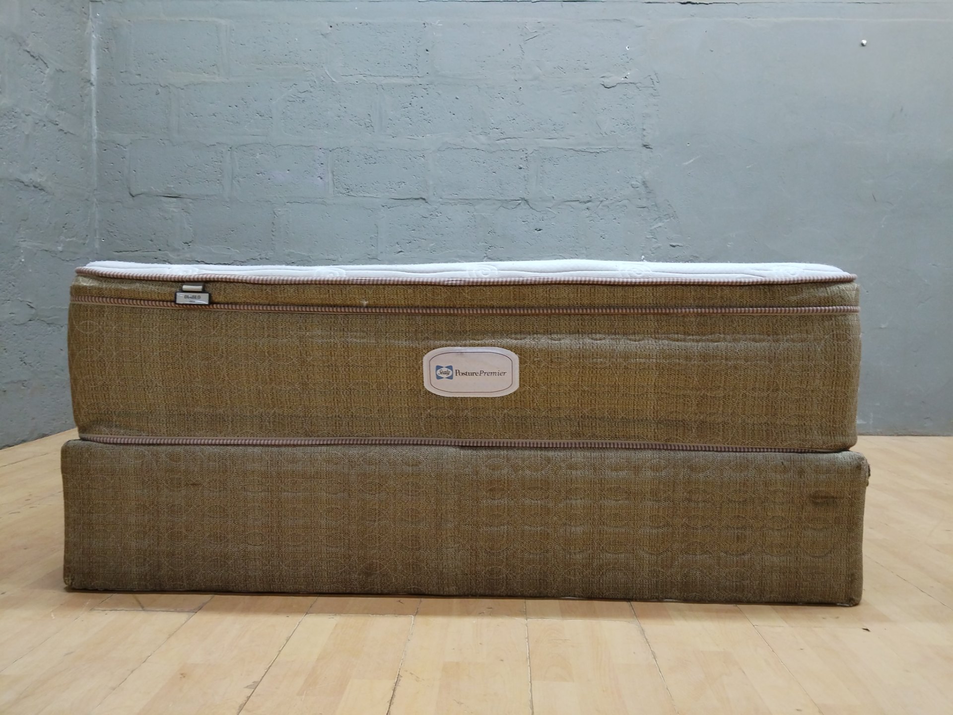Sealy Posture Premier ‘Diablo Firm’ mattress + divan base — 152 × 188 cm (used, stained, torn base)