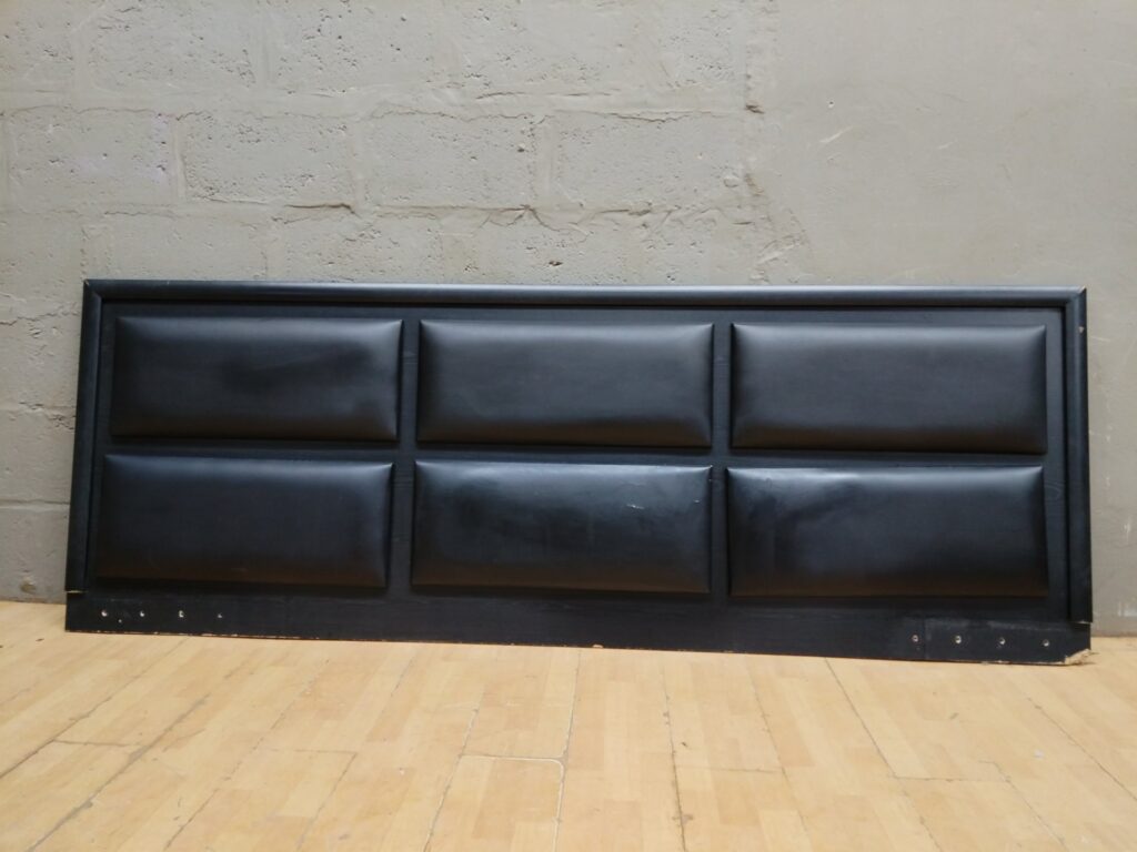 Black padded faux‑leather king headboard (250 x 90 cm) — panelled design, wooden frame — used, cosmetic damage