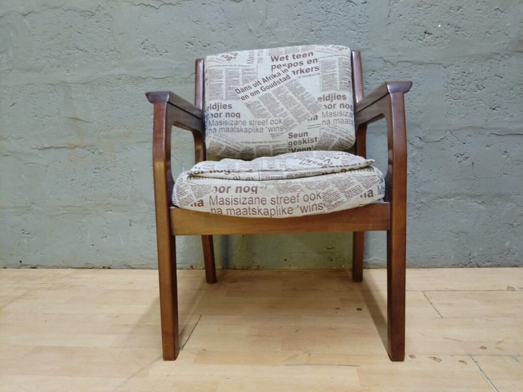 Newspaper-print Upholstered Wooden Armchair — Solid Frame, Used