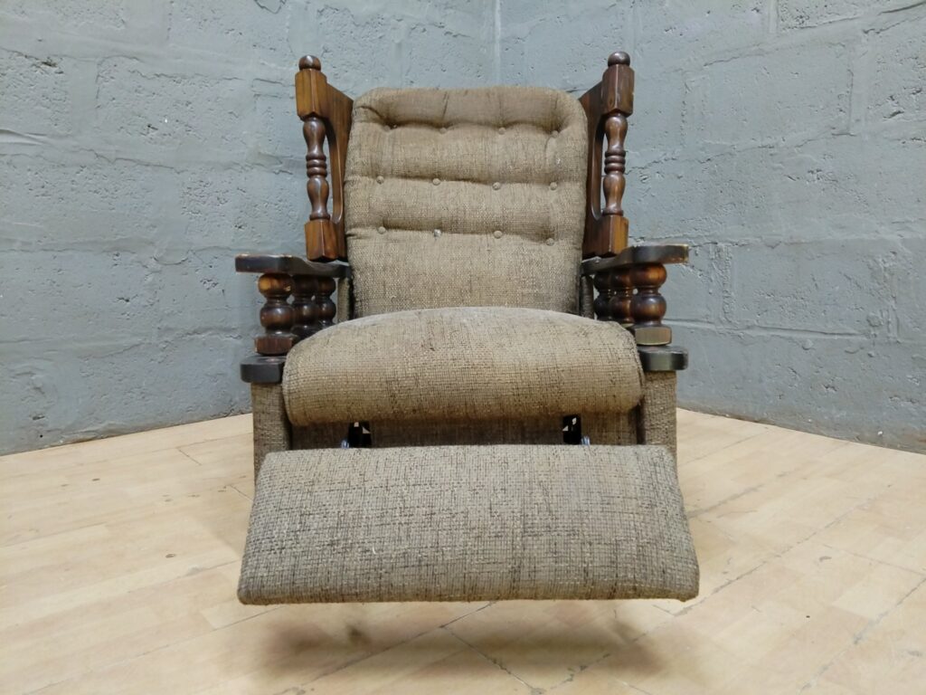 Wood-framed Tufted Reclining Armchair with Fold-out Footrest — Solid Spindles, Worn Upholstery