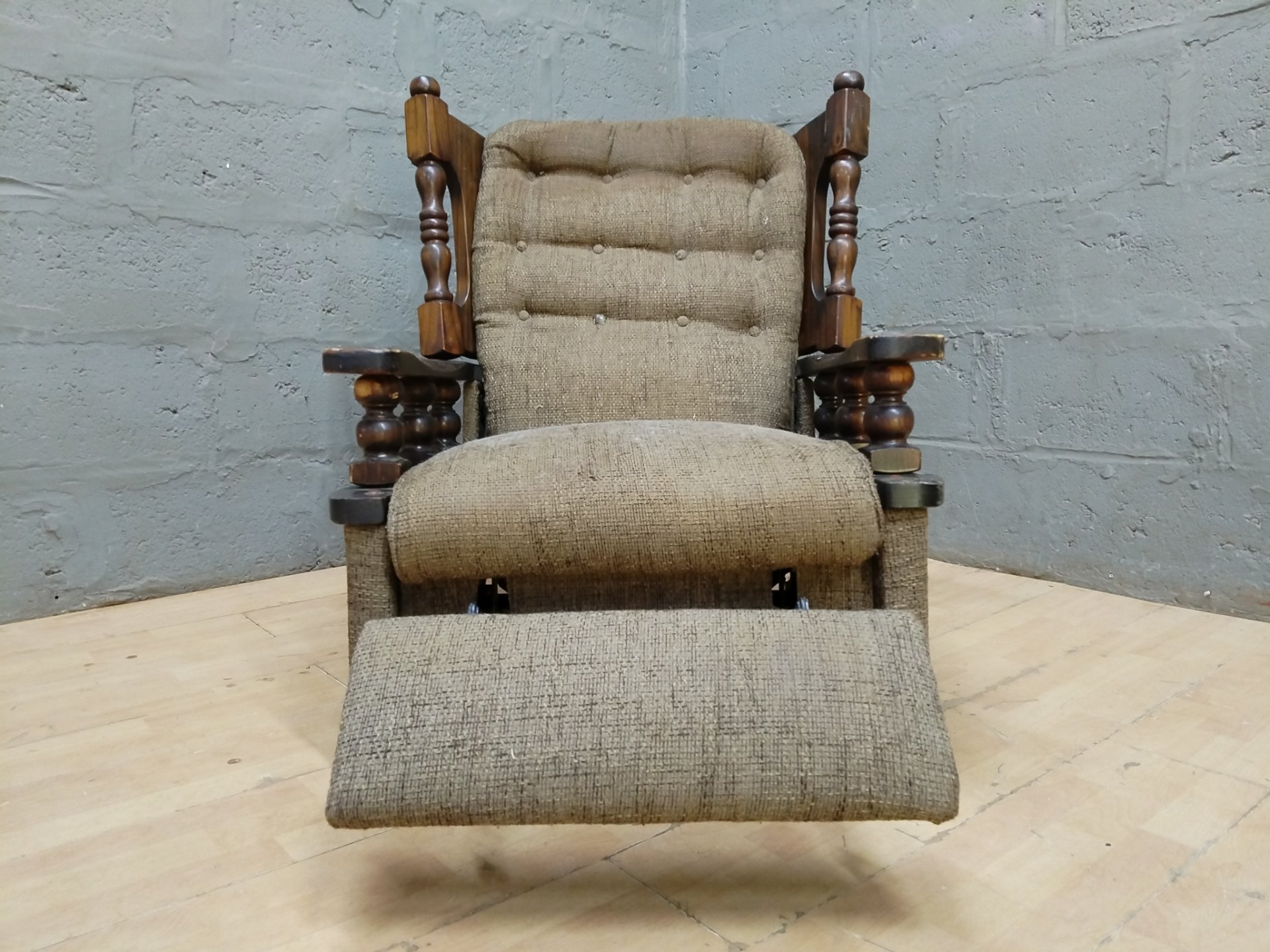 Wood-framed Tufted Reclining Armchair with Fold-out Footrest — Solid Spindles, Worn Upholstery