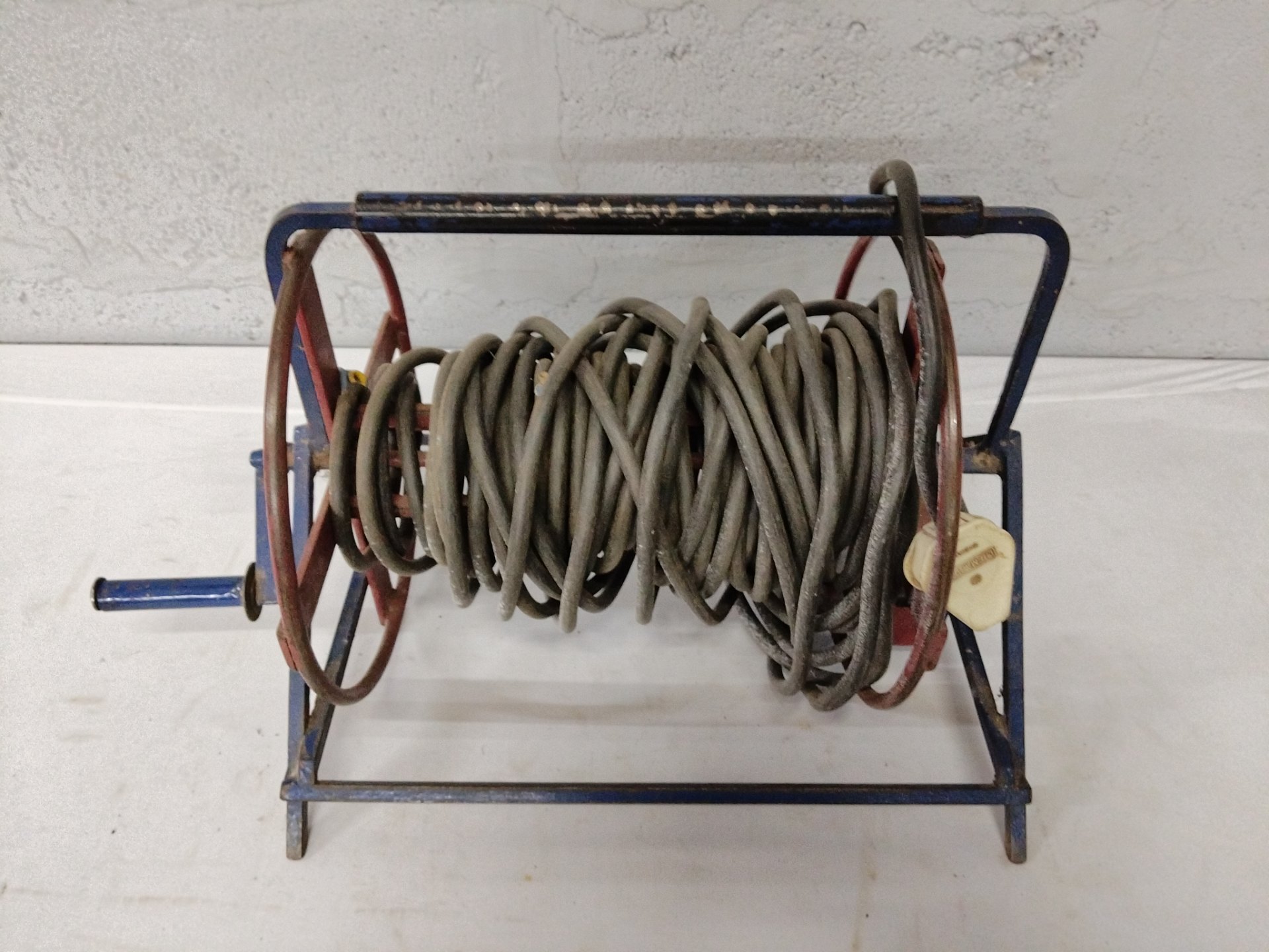 Used Metal Hand-Crank Cable Extension Reel with Coiled Power Cable and Single Socket