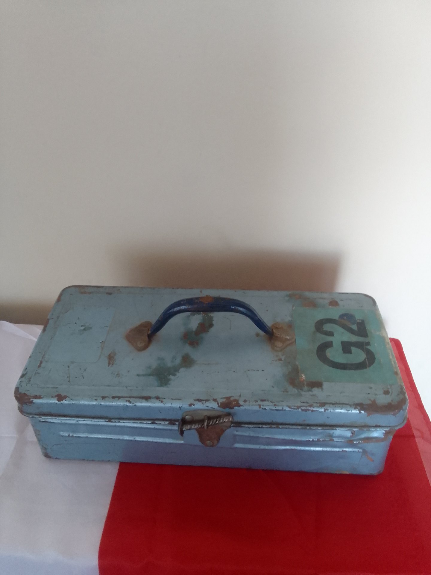 Blue metal toolbox stencilled ‘G2’ – well used, empty, latch damaged