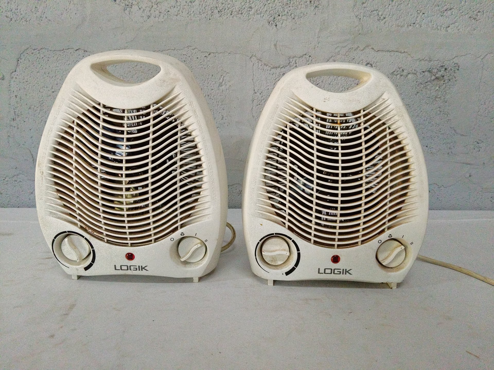 Pair of Logik NSB-200A 2000W Portable Fan Heaters — working, heavy cosmetic wear