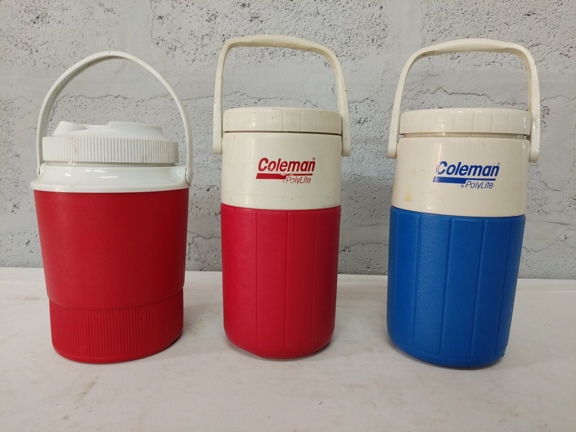 Lot of 3 Coleman PolyLite insulated drink jugs / water coolers — 2 red, 1 blue, lids & handles
