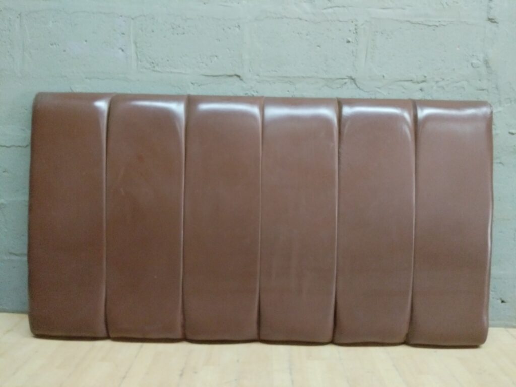 Brown faux-leather padded headboard 185 x 101 cm — vertical channel panels, mounting brackets attached