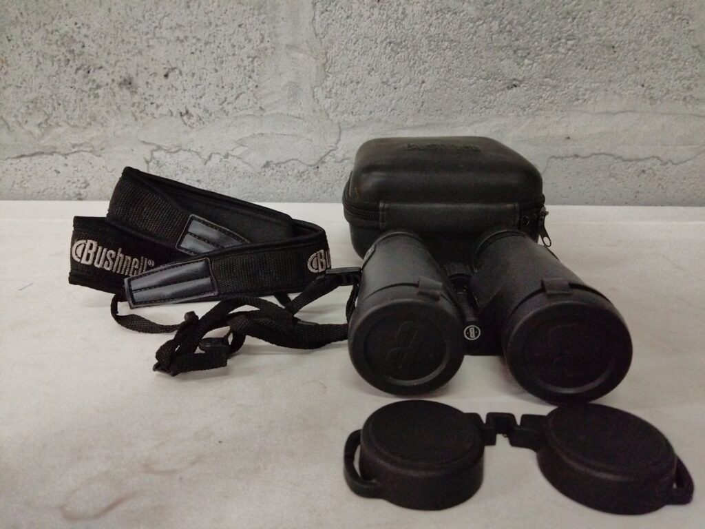 Bushnell binoculars with case, strap and lens caps – used, optics checked