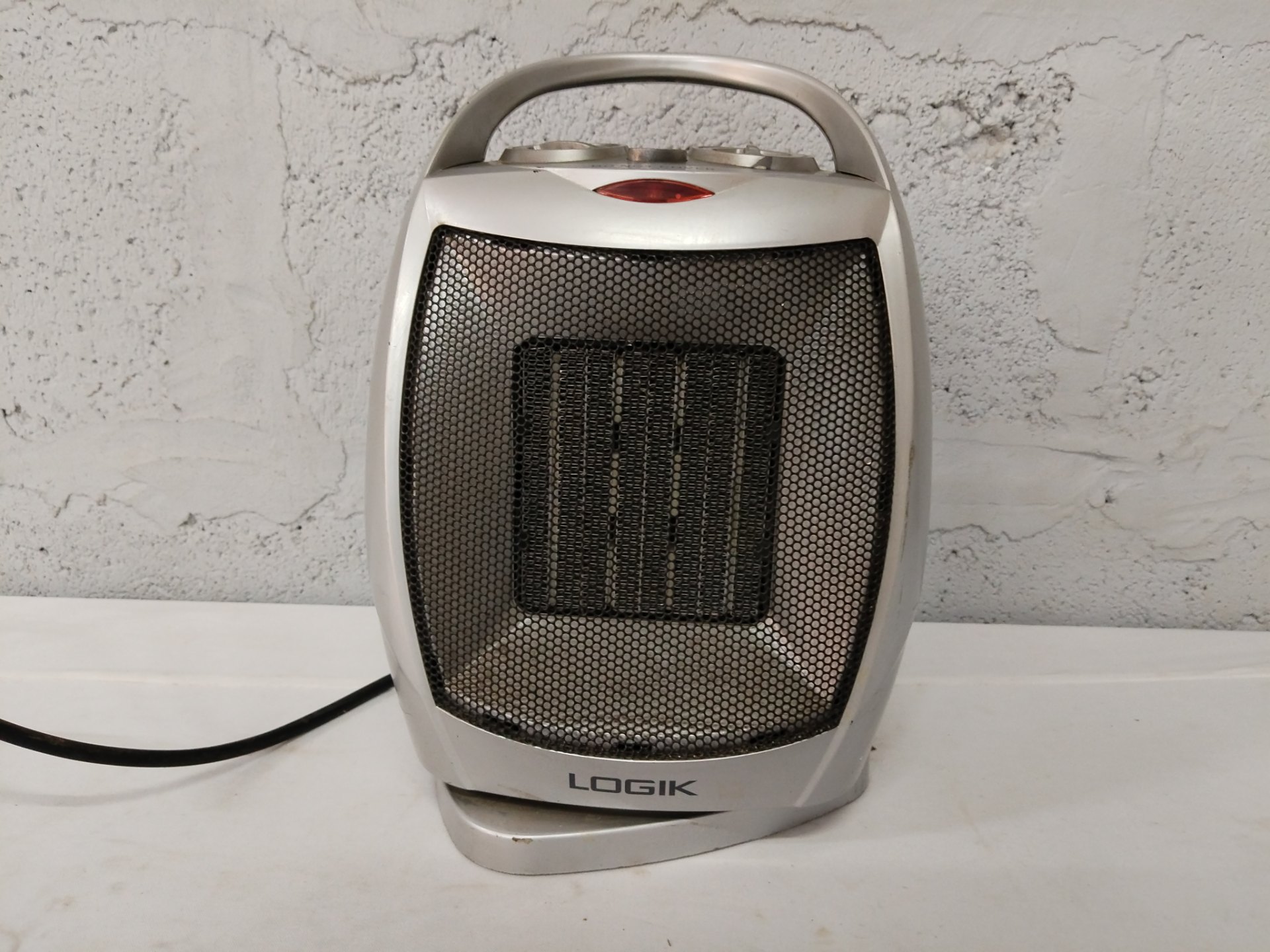 Logik PTC Fan Heater PTC-1502 (1500W) — portable ceramic heater, used with cracked casing