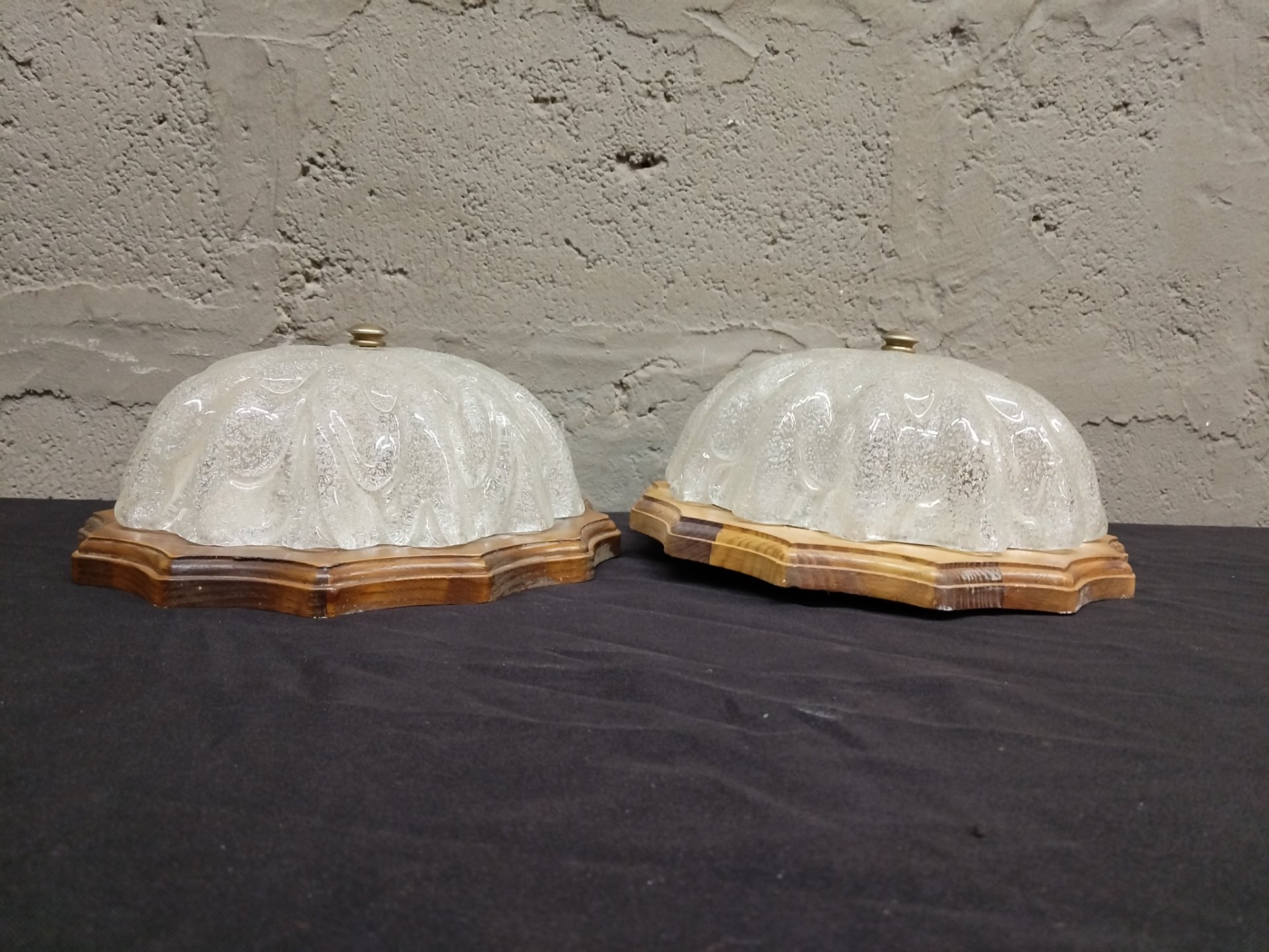 Pair of decorative ceiling flush-mount lights — textured bubble glass shades on shaped wooden backplates