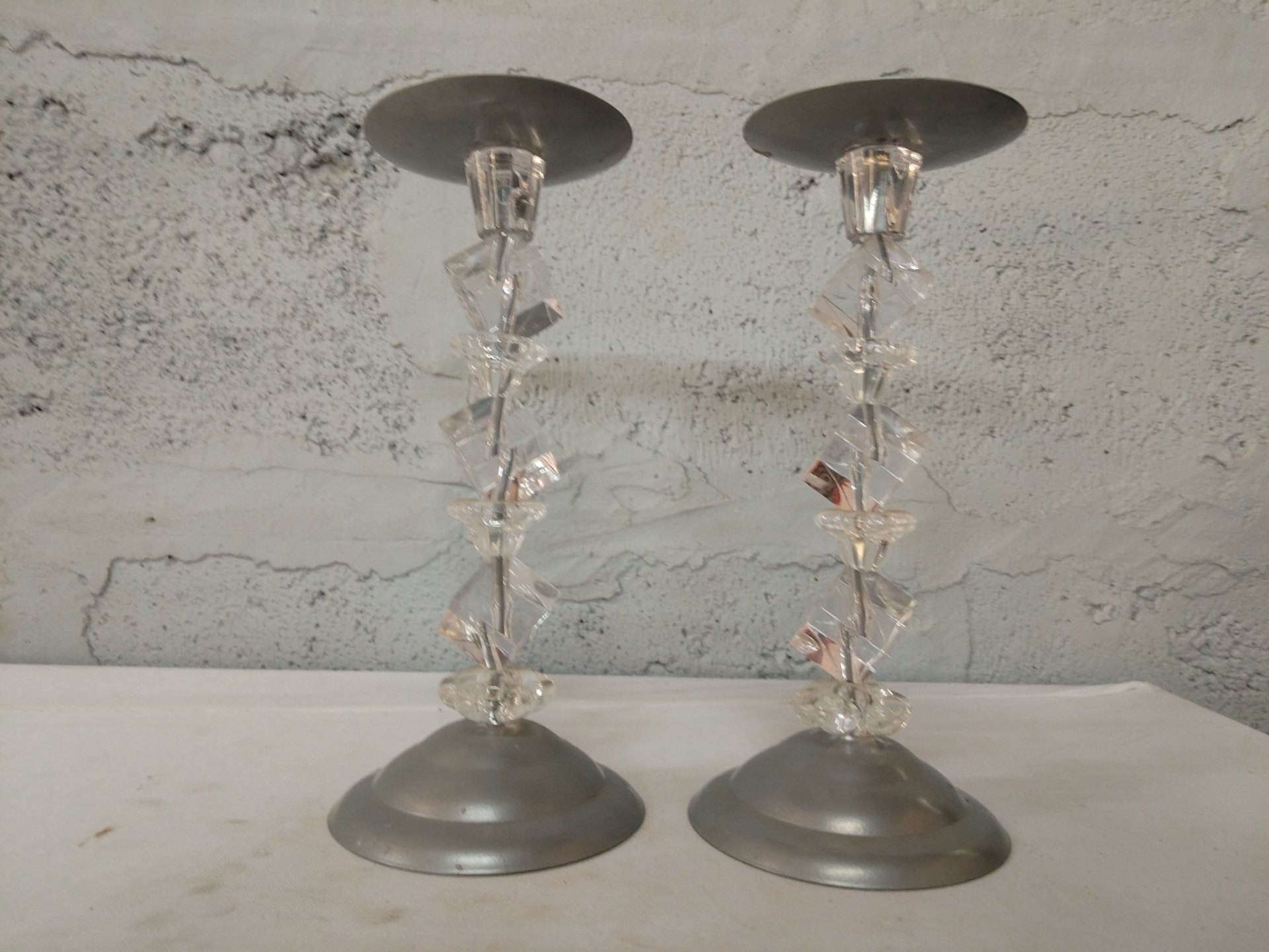 Pair of decorative stacked acrylic candlestick holders with metal bases — pair, top spikes present