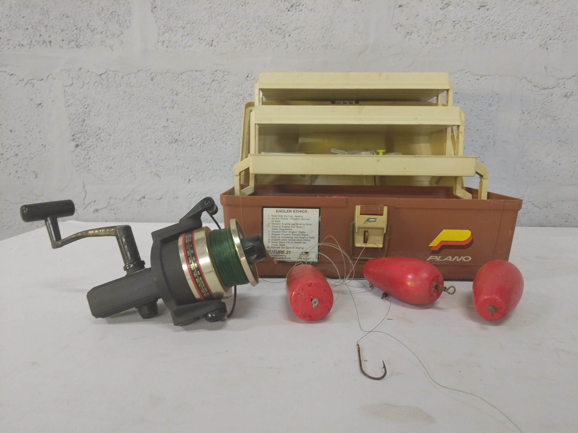 Plano 3-tier tackle box with Shakespeare spinning reel + mixed terminal tackle (est. 50pcs)