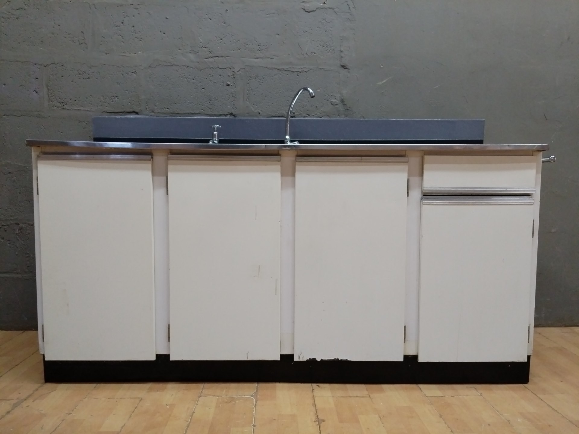 Freestanding kitchen sink unit — stainless double bowl top with cabinet base (180 × 55 × 108 cm)