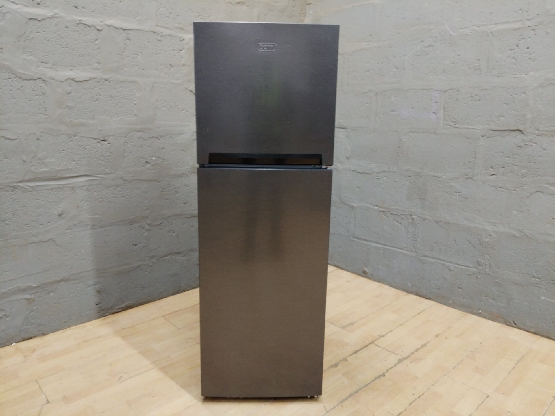 DEFY top-freezer refrigerator — metallic finish, interior light on, shelves & crisper included