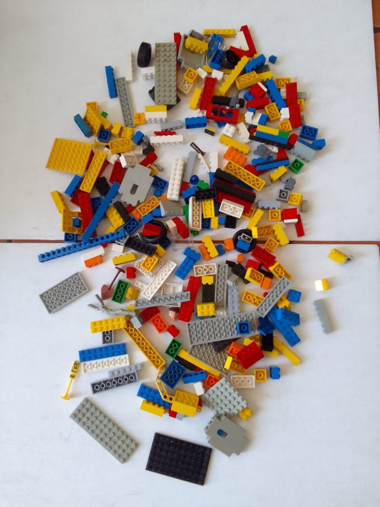 Lot of Lego — Mixed small bricks, plates, wheels and parts (used, minor wear)