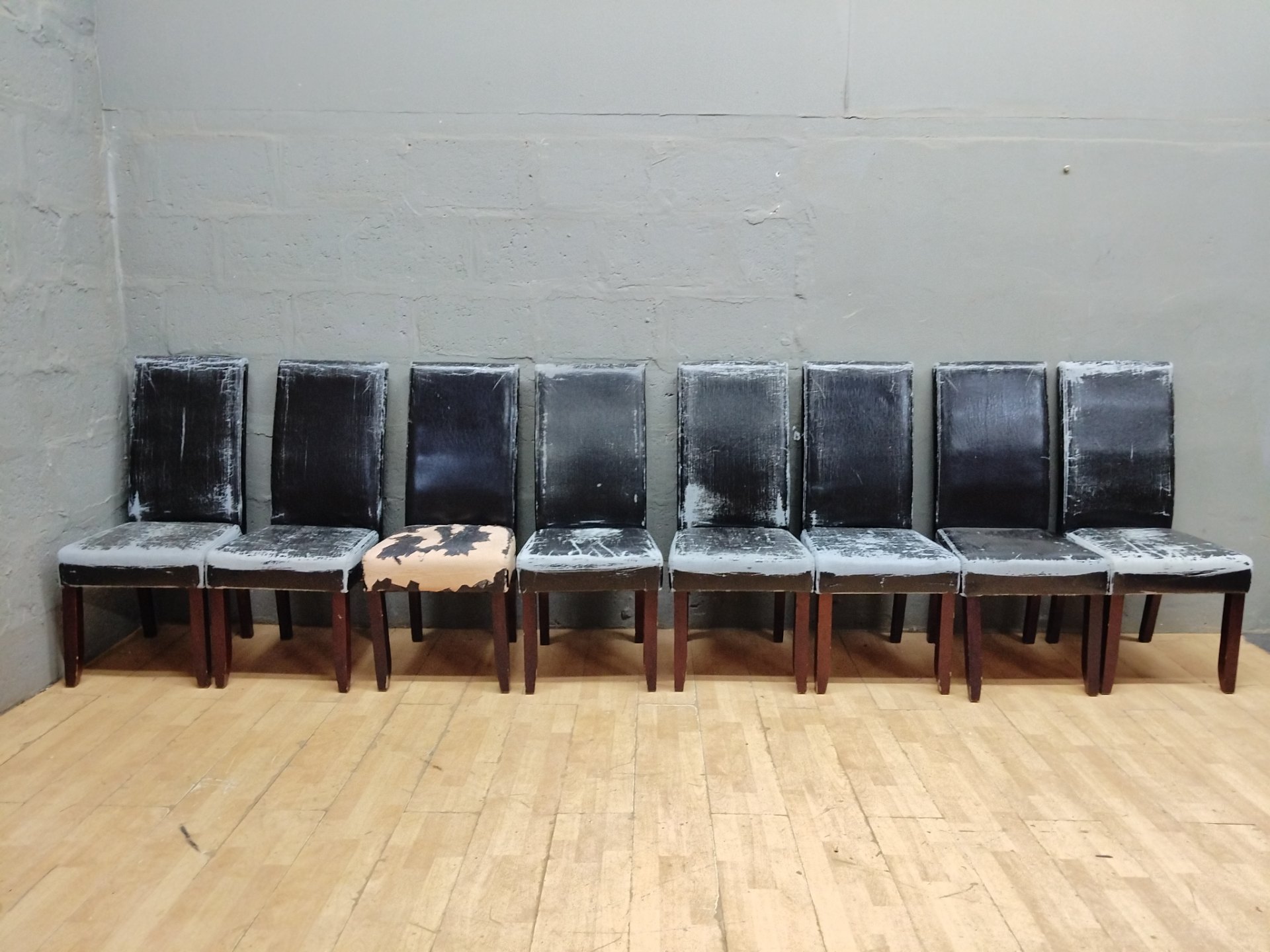 Set of 8 dining/side chairs – matching wooden frames, heavy upholstery wear, one seat with large missing cover