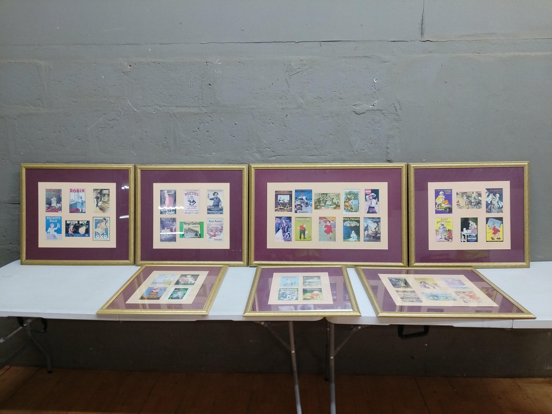 Set of framed reproduction advertising prints — gilt frames, double-matted, glazed (one frame approx. 88 x 58 cm)