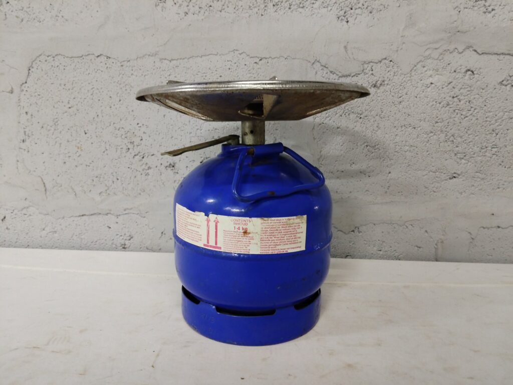 Portable single‑burner camping gas stove on 1.4 kg refillable cylinder — used, working, cosmetic wear