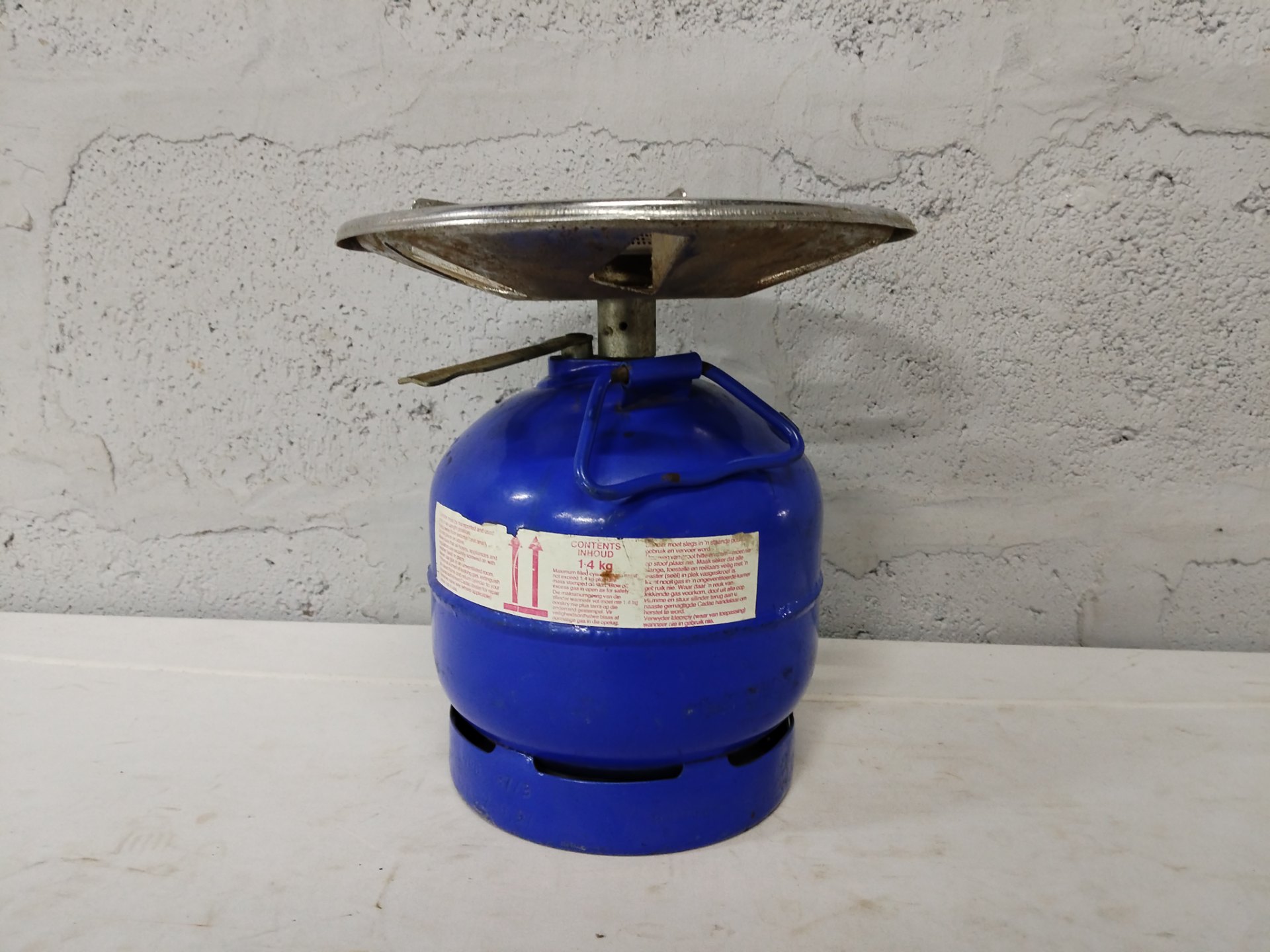 Portable single‑burner camping gas stove on 1.4 kg refillable cylinder — used, working, cosmetic wear