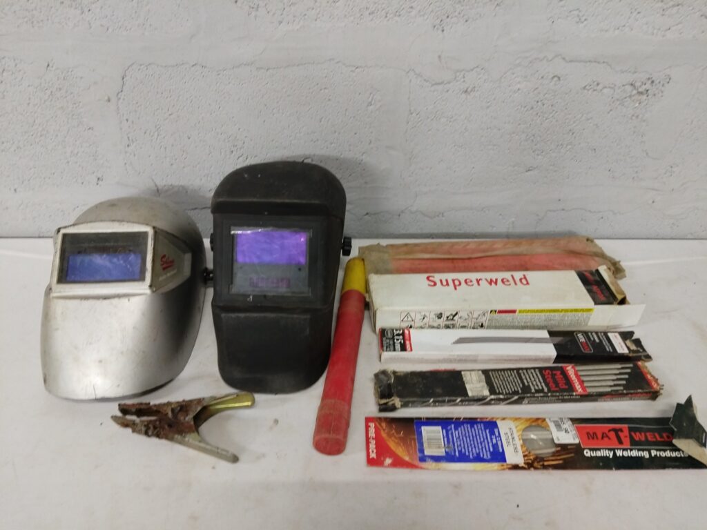 Mixed Welding Gear — 2 Auto‑Darkening Helmets + Boxes of Electrodes, Electrode Holder & Earth Clamp