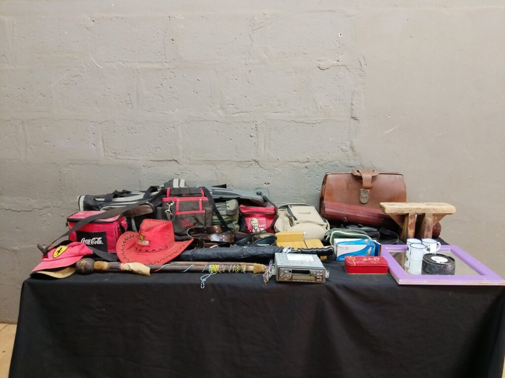 Mixed lot — 15 used bags, hats, belts, walking sticks, wooden stool, tins, mirror + car stereo (not working)