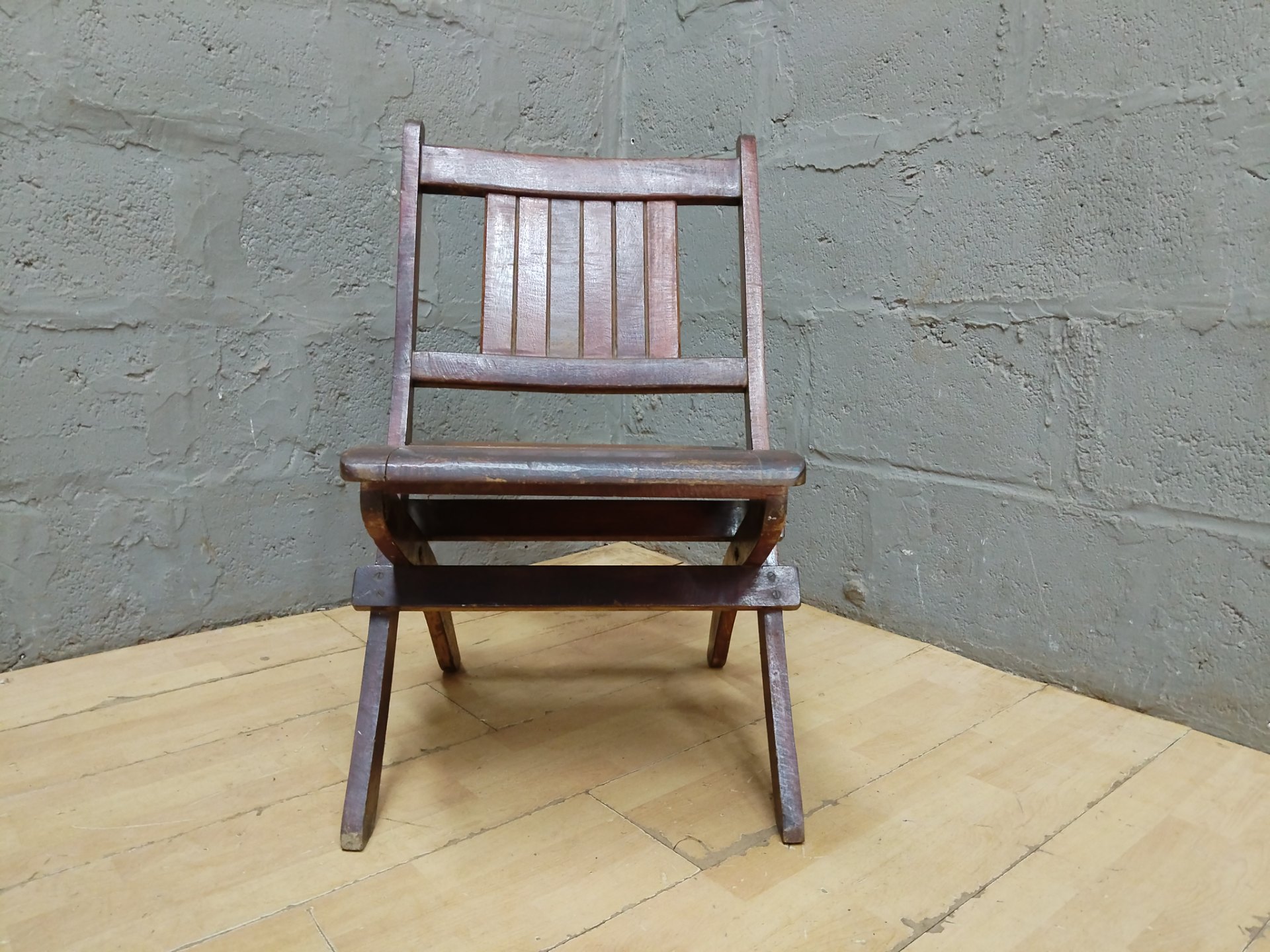 Used wooden folding slatted chair — folds and locks securely, slatted seat & back