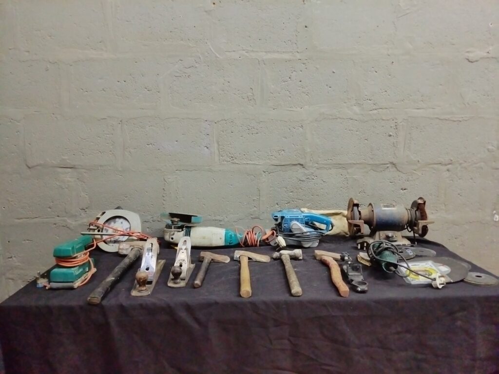 Bulk lot of 23 used hand and corded power tools — grinders, circular saw, planes, hammers, discs