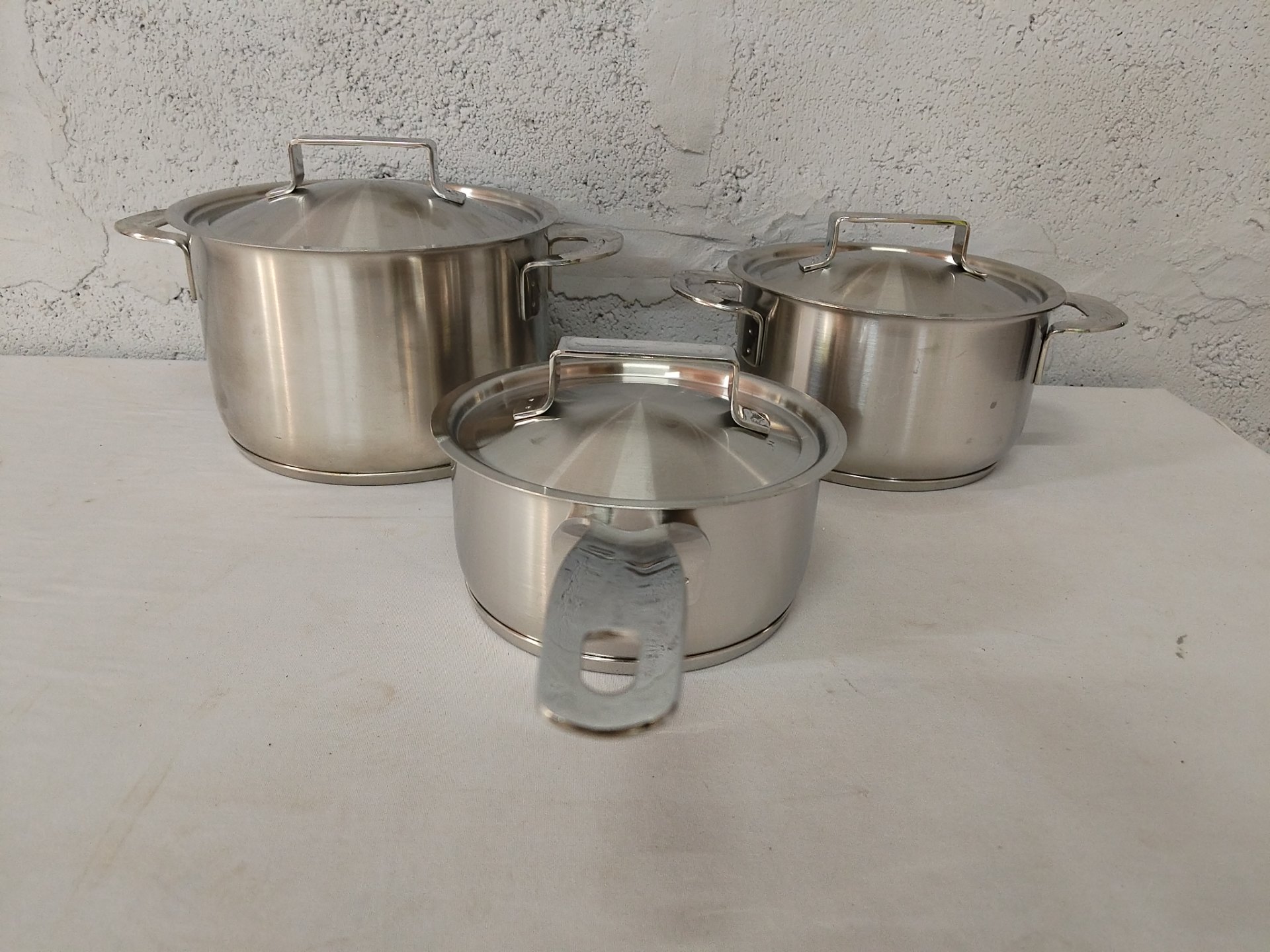 Iittala (as pictured) stainless-steel 3-pot cookware set with lids — used, good condition