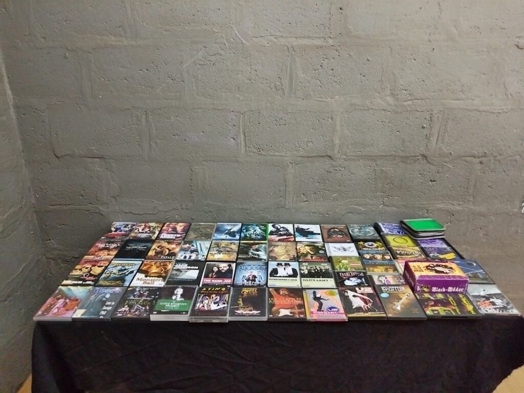 Bulk lot 56 assorted DVDs & CDs — mixed films & music, cases present, light wear