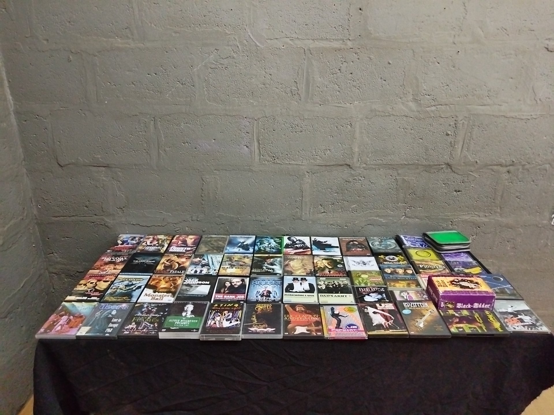 Bulk lot 56 assorted DVDs & CDs — mixed films & music, cases present, light wear