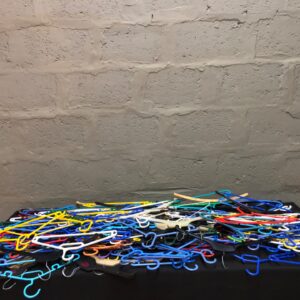 Bulk mixed plastic hangers — approx. 102 pieces, assorted colours, used condition