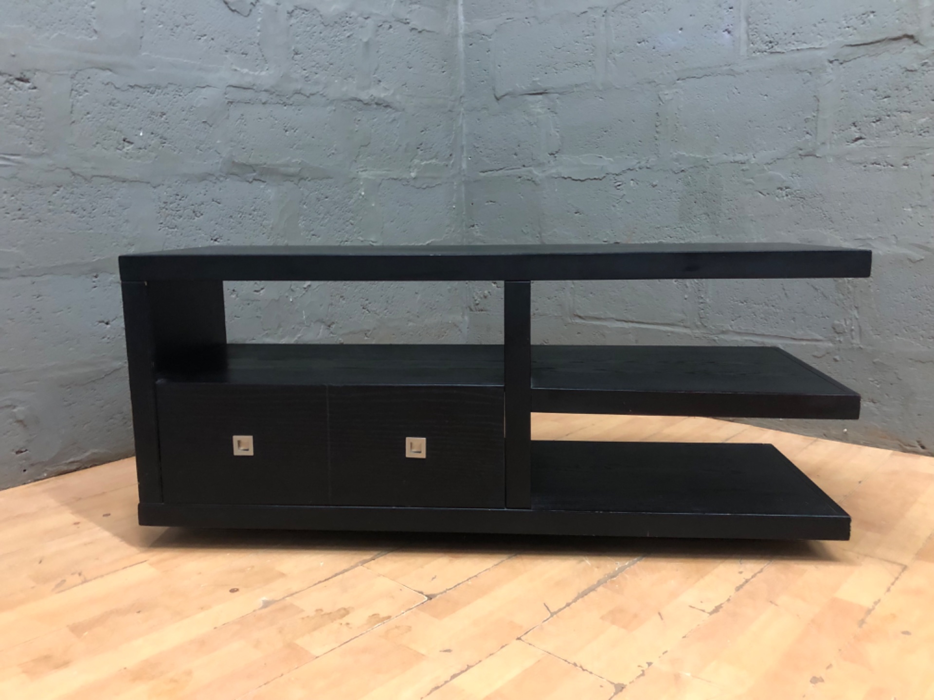 Black laminated stepped TV / media unit with two drawers and open shelving