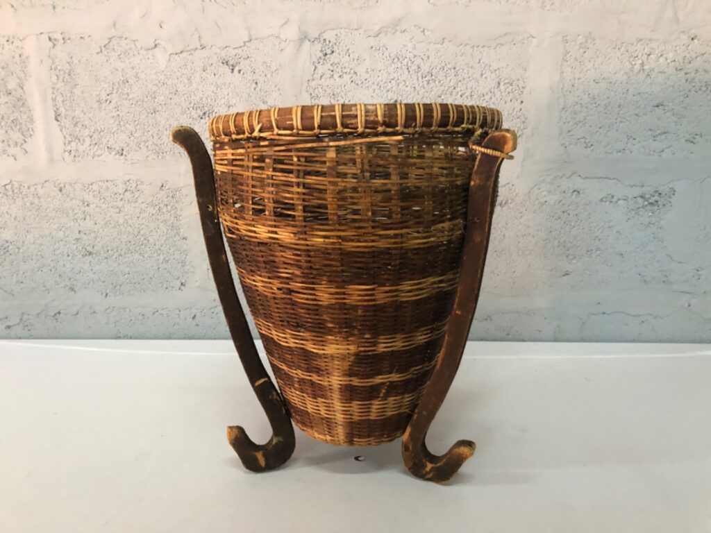Wicker hanging/creel style basket with wooden supports — worn, repair present