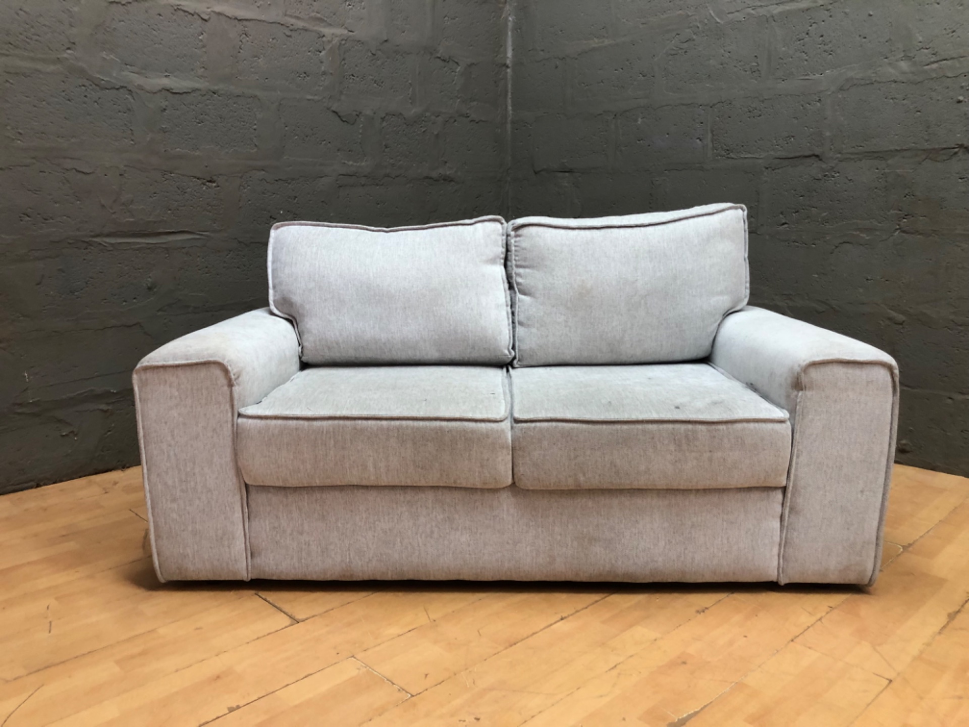 Light-grey 2‑seater fabric sofa / loveseat — used, visible stains — 173 x 87 x 70 cm