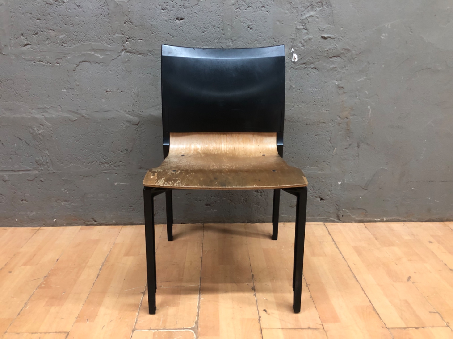 Moulded plywood seat chair with black plastic back & metal legs — heavy seat wear