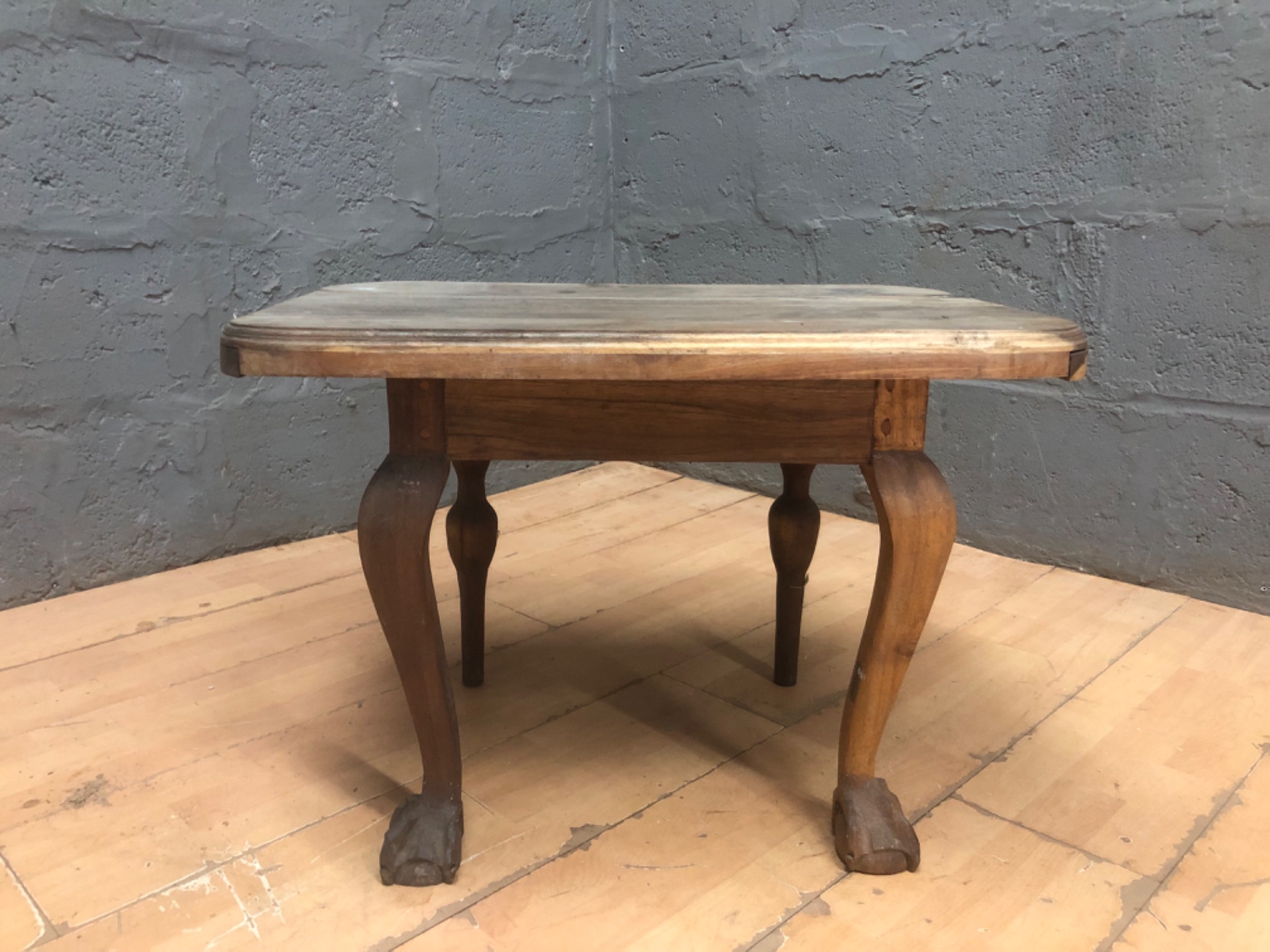 Small wooden occasional/coffee table with cabriole legs & claw feet — worn top, needs restoration